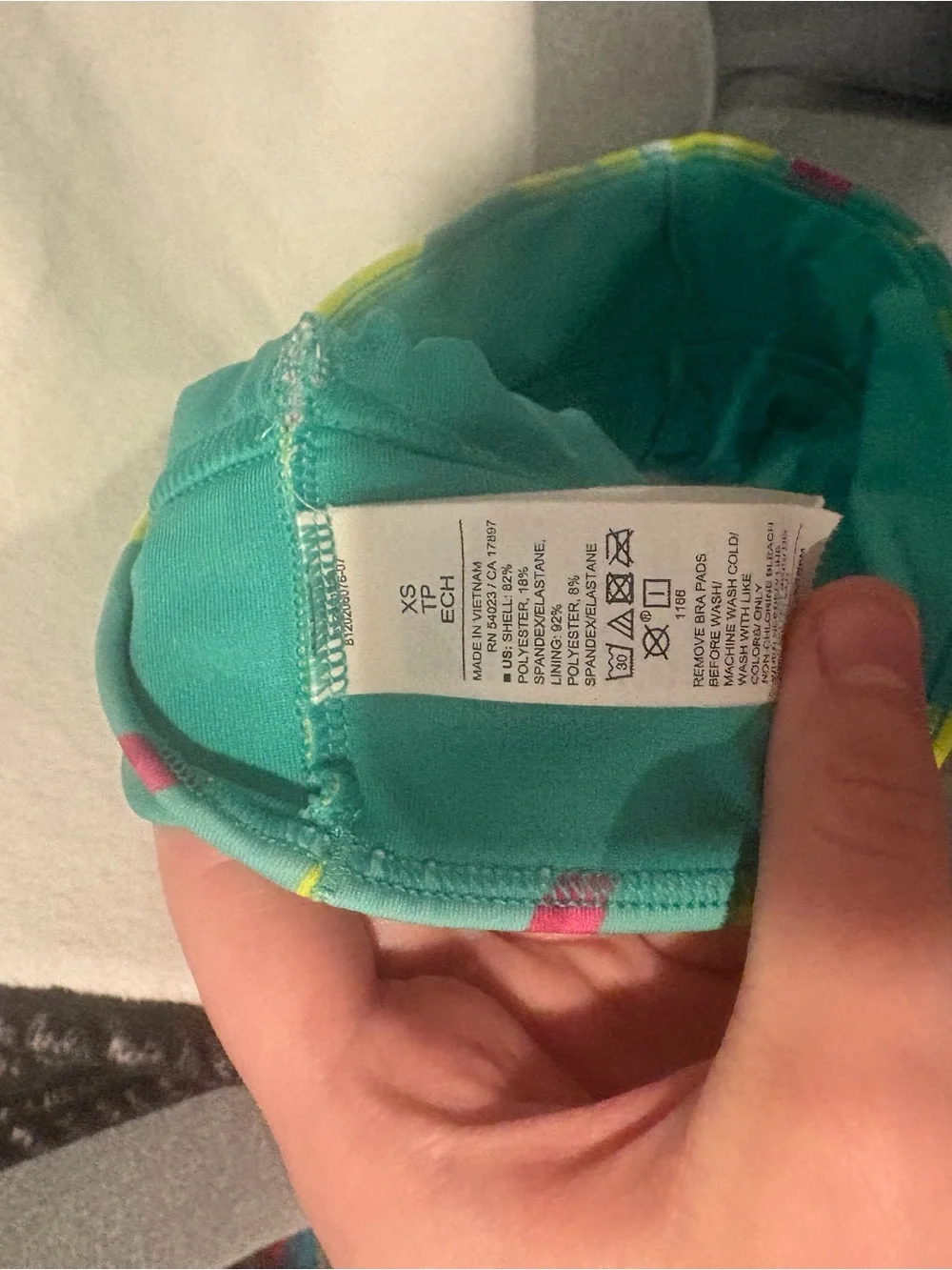 Kids turquoise garment with care tag